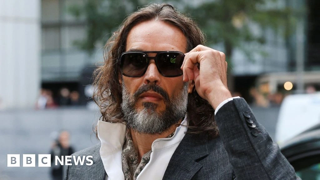 Russell Brand arrives at court for start of rape trial